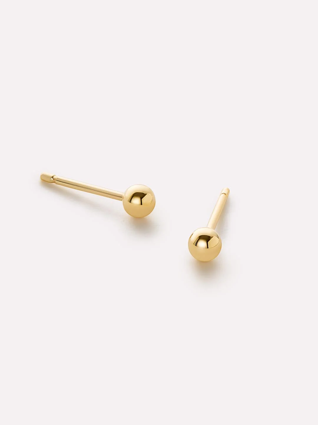 Gold stud earrings
